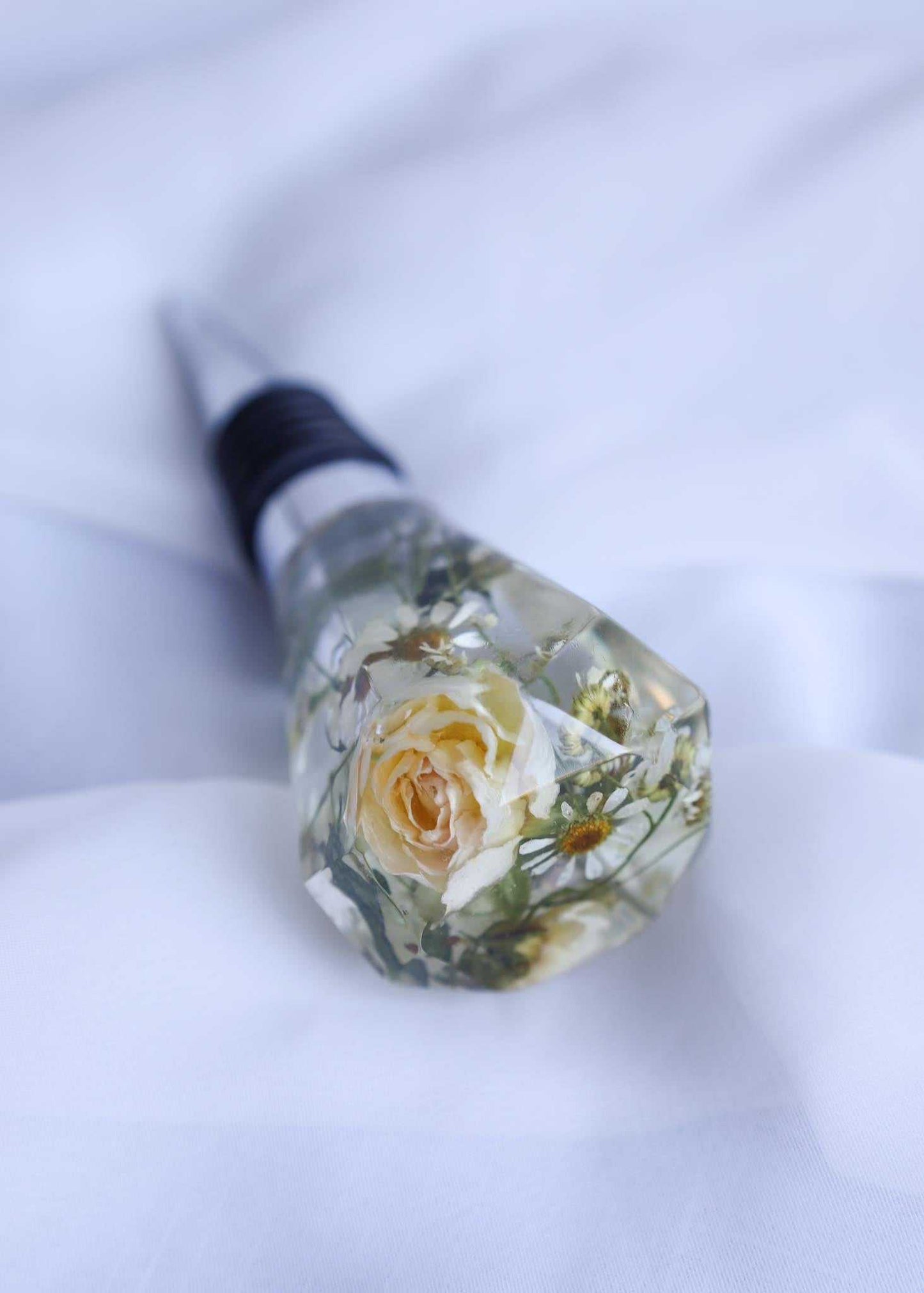 Custom resin wine bottle stopper with preserved bridal bouquet flowers