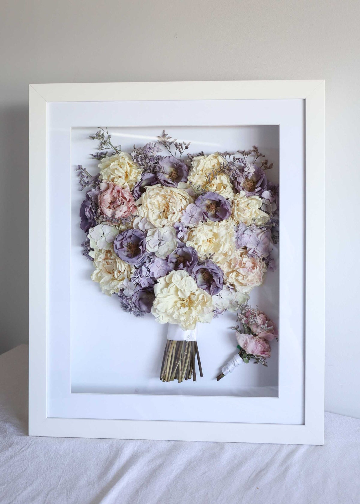 Framed preserved bouquet 40x50 with UV protective glass showcasing bridal flowers