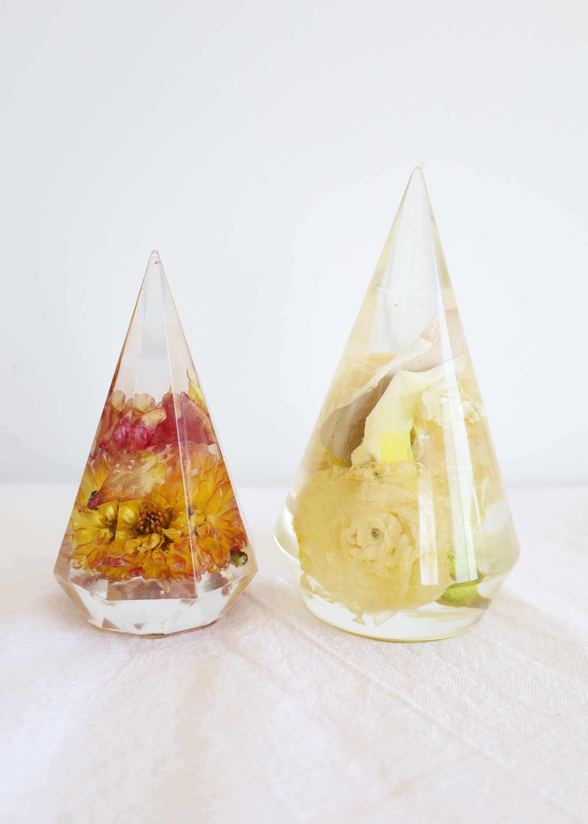 Resin ring holder with preserved bridal bouquet flowers for displaying rings