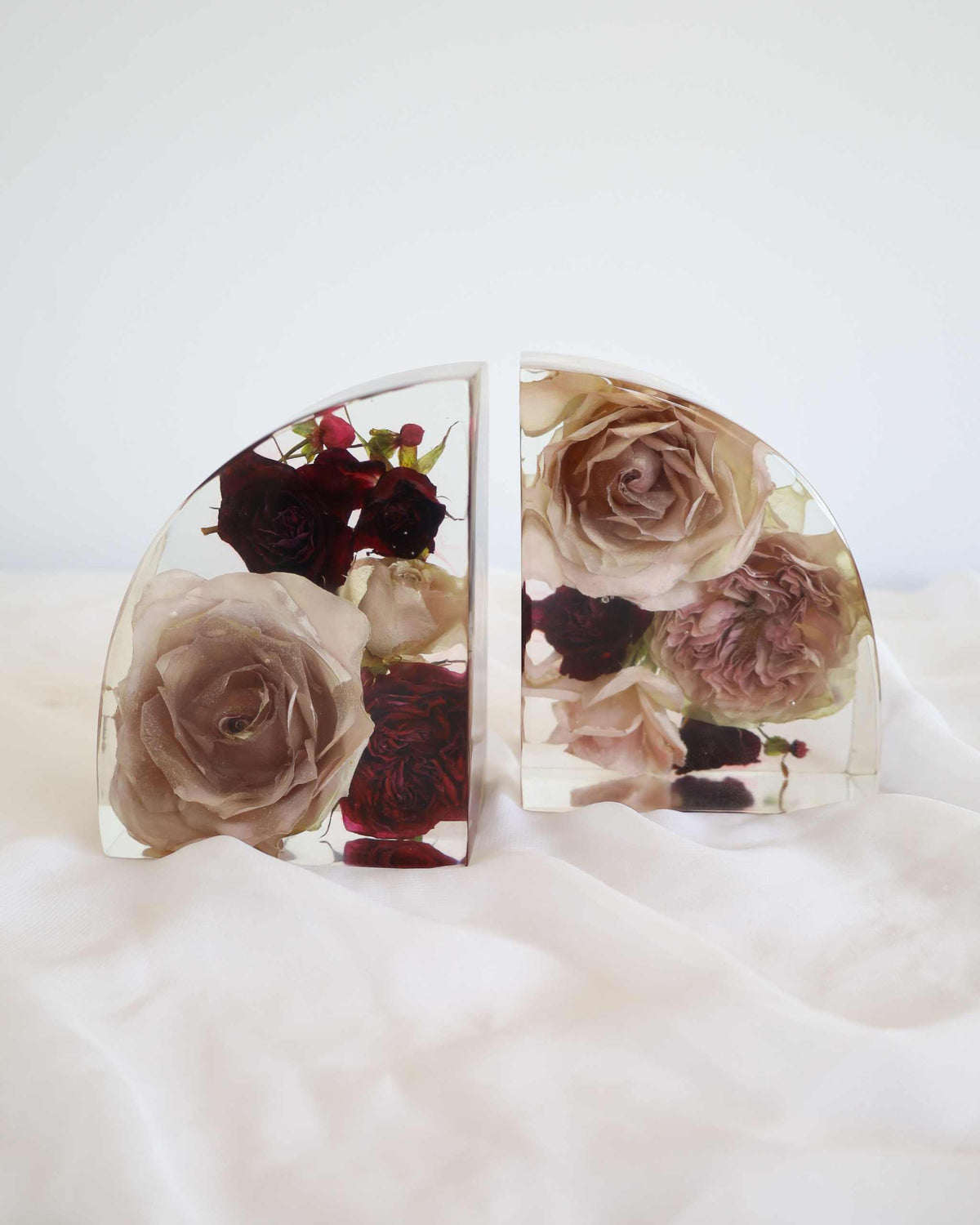 Set of resin display book ends with dried flowers encased, clear and black background options, 16cm tall by 12cm wide
