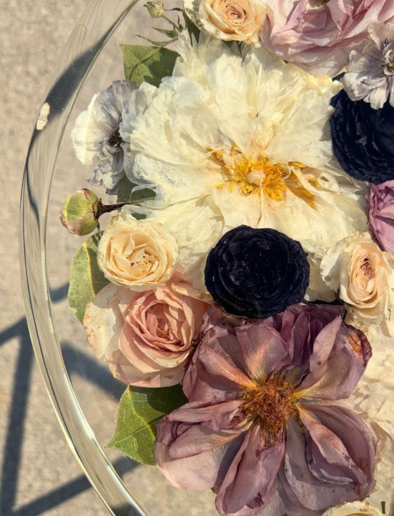 Custom preserved floral resin cake stand with dried flowers encased in clear resin