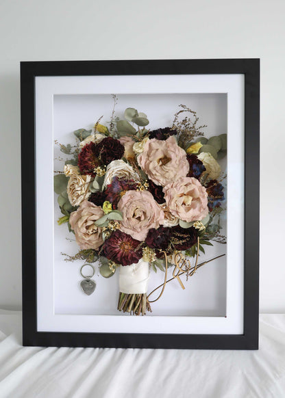 Flower frame duo showing a preserved bouquet of blush roses and burgundy blooms in a black shadow box frame.