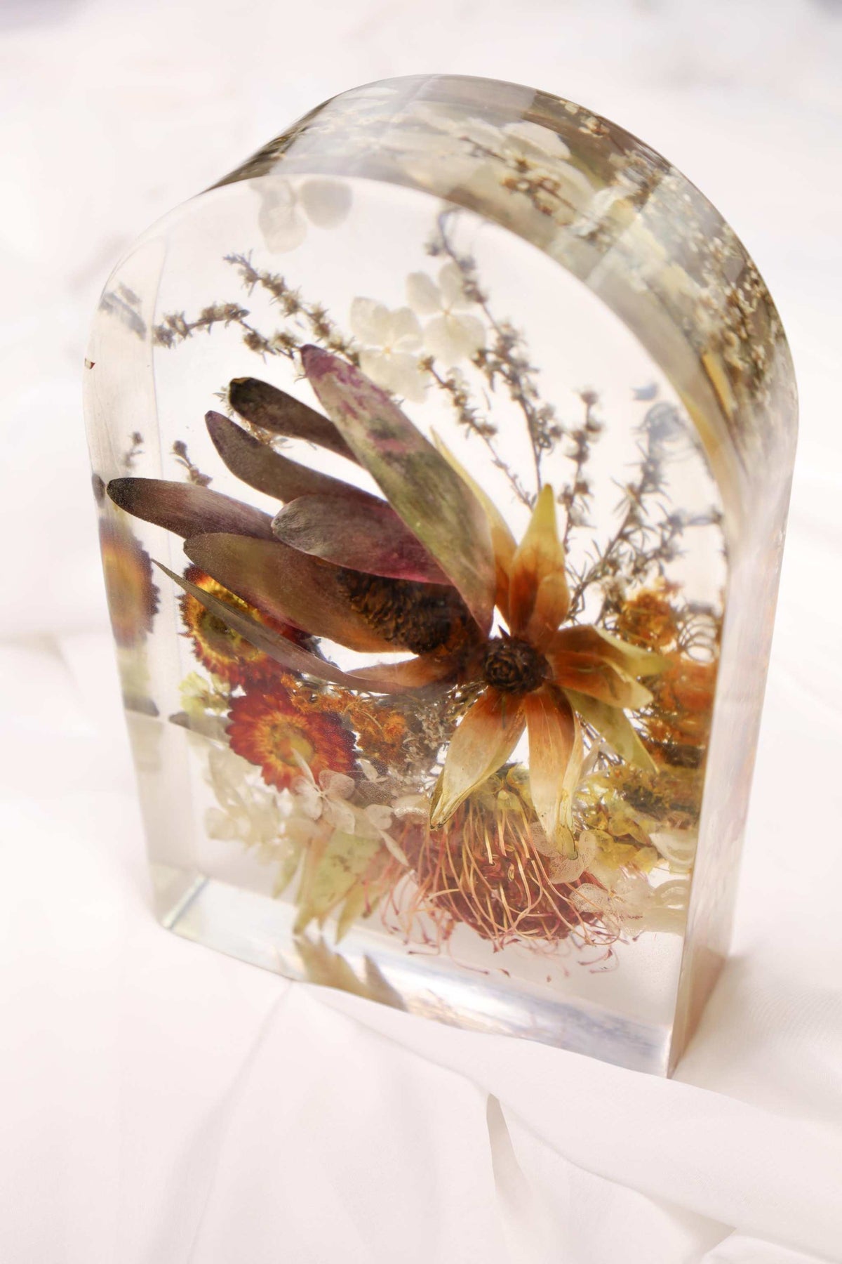 Bridal Preservation All Resin Package features a clear resin arch with preserved dried flowers in muted earthy colours.