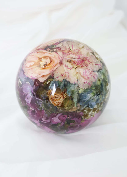 Resin dome paper weight preserving bridal bouquet flowers in clear sphere display