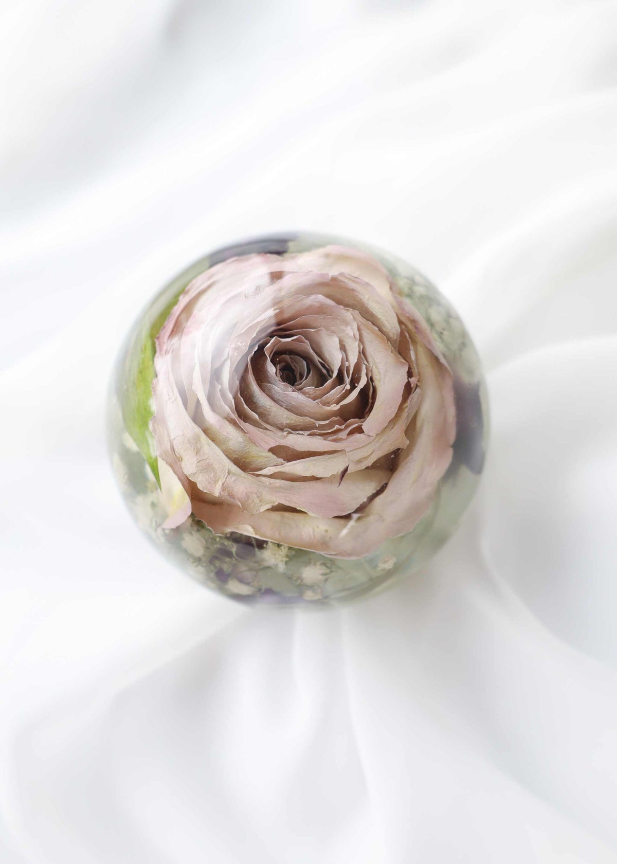 Resin dome paper weight with preserved bridal bouquet flowers inside