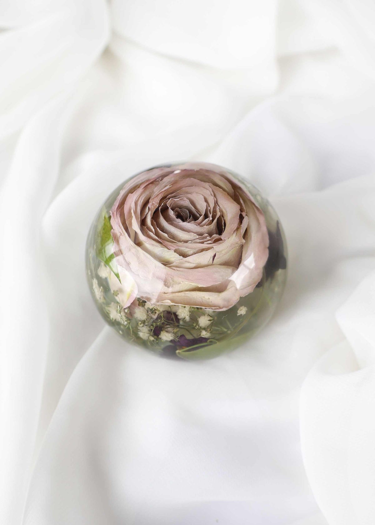 Custom resin dome paper weight preserving bridal bouquet flowers in a clear sphere
