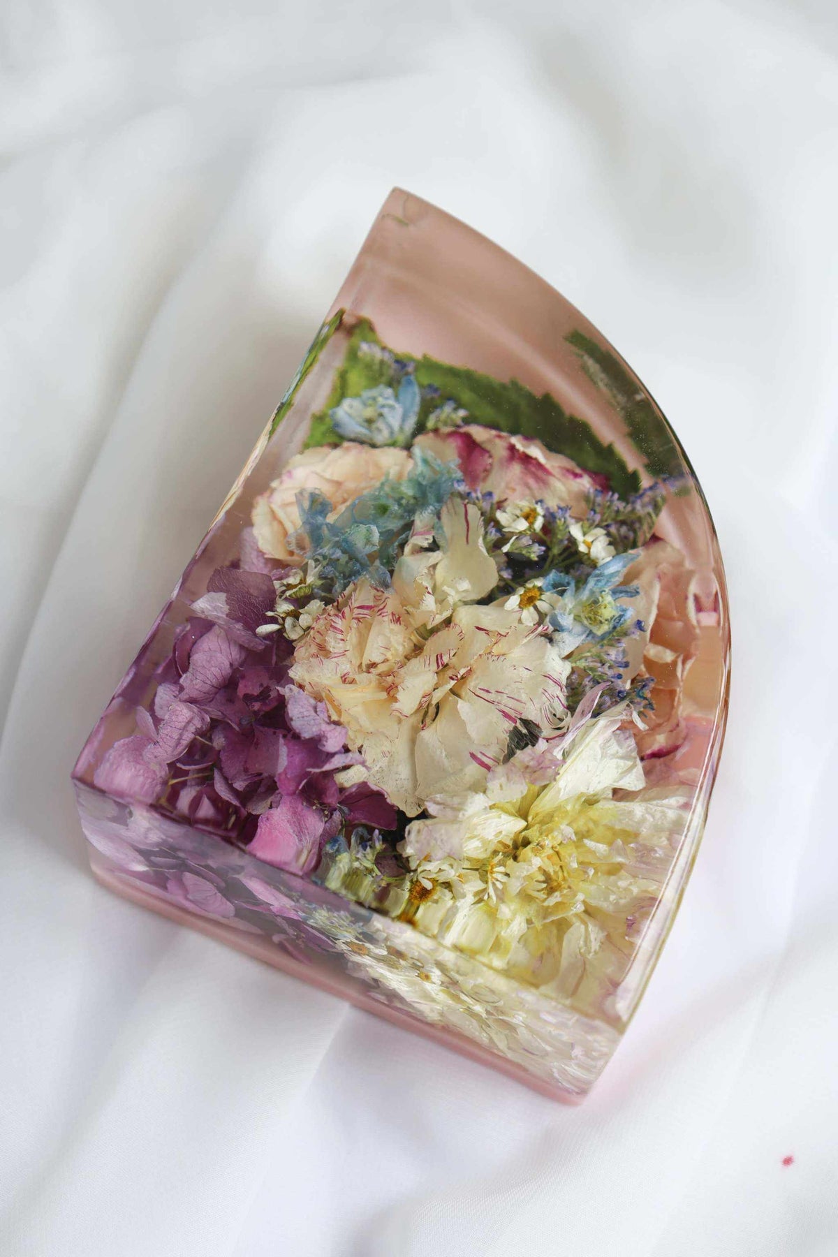 Set of Resin Display bookend with clear resin, pastel pink tint and preserved multicoloured flowers embedded inside